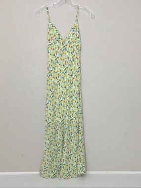 Floral Cutout Maxi Dress in white with green, yellow and orange floral print.